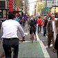 No room for Pedestrians on NYC's 8th Ave so they walk in Protected Bike Lane