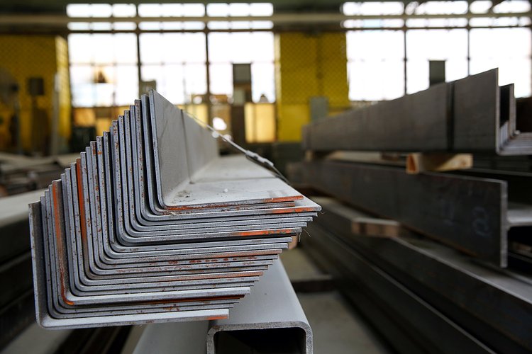 Stacks of metal components await.