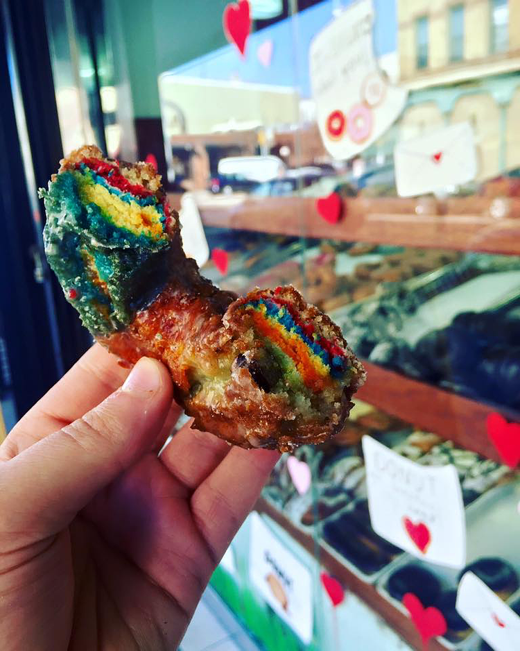 We're changing the game with this new Rainbow Cake Donut. (Just a little secret... It's not food coloring but it's a mixture of your favorite cake donuts)