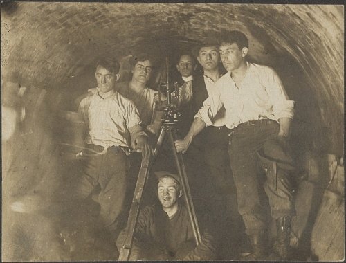 Engineers in tunnel during construction of present IRT at City Hall Station. ca. 1900
