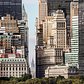 Looking up Broadway with a view of the Chrysler Building sticking in between the large canyon of stone walls