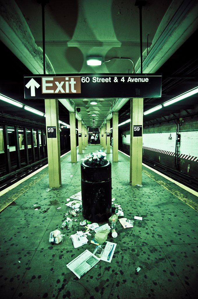 Modern Culture | There are many times that I think to myself:
 "What the hell are people thinking?" 
Well, yesterday night there was one of these moments when I saw this bin. Apparently, the bin got full, but people didn't notice. People kept on throwing their litter away, although they knew that the waste was going to end up on the floor. But the question is...Who cares?? Do YOU care? People could have just held on to their bottles/wrappings etc, till they found a proper bin. But obviously they didn't care...

<u>Info</u>
Nikon D90 
Tokina 11-16 @ 11mm
f/3.2
1/25 sec handheld
ISO 400
Post processing using LR3