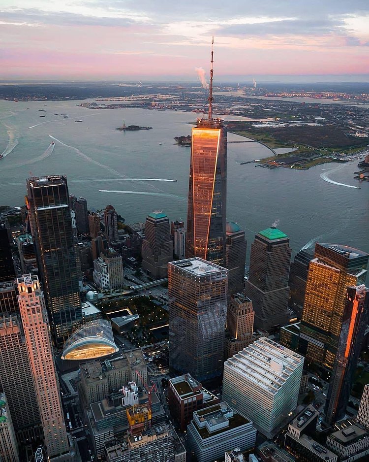 Sunrise over Lower Manhattan. Photo via @m_bautista330 #viewingnyc #newyork #newyorkcity #nyc #sunrise #oneworldtradecenter
