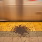 Undisturbed pile of gunk on a NYC subway platform.