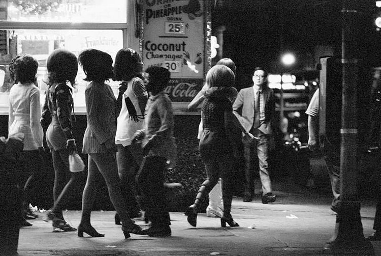 A group of prostitutes walk through the side streets of Broadway and Times Square in New York in the summer of 1971.