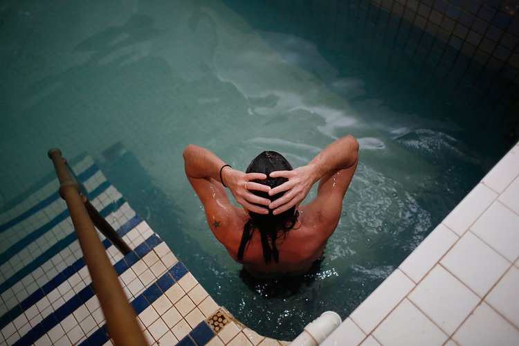 Jason Russell, 42, in the cold pool after sitting in the saunas.