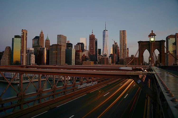 Sun rising on Brooklyn Bridge and Lower Manhattan