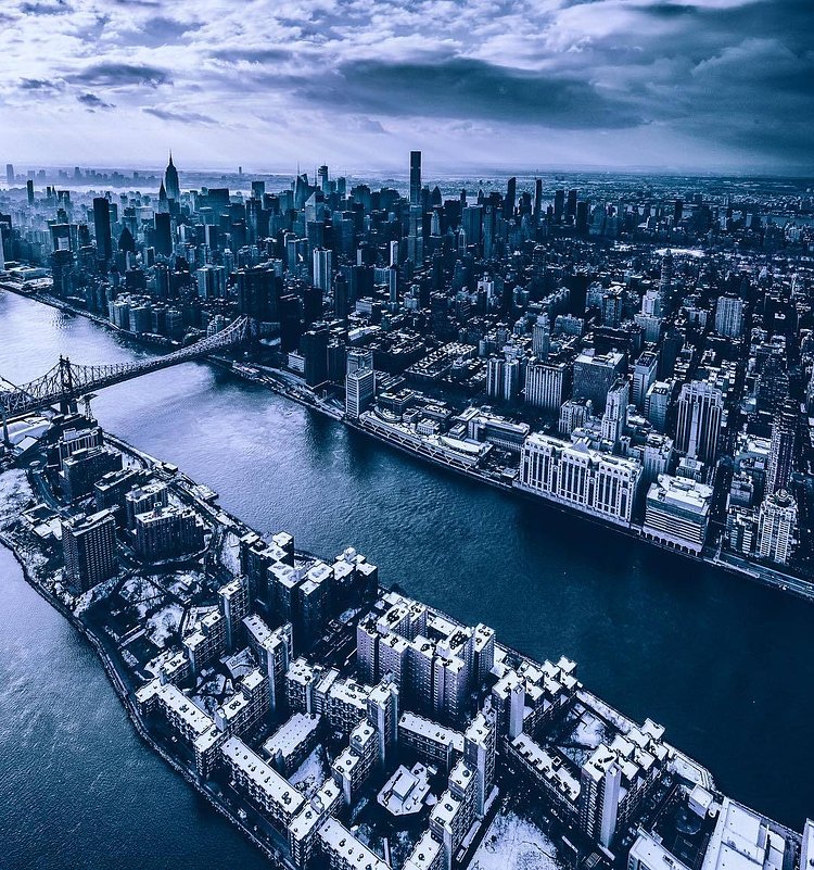 Snow-covered Roosevelt Island and Midtown Manhattan