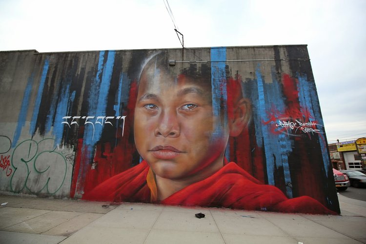 Adnate creates a new piece for The Bushwick Collective