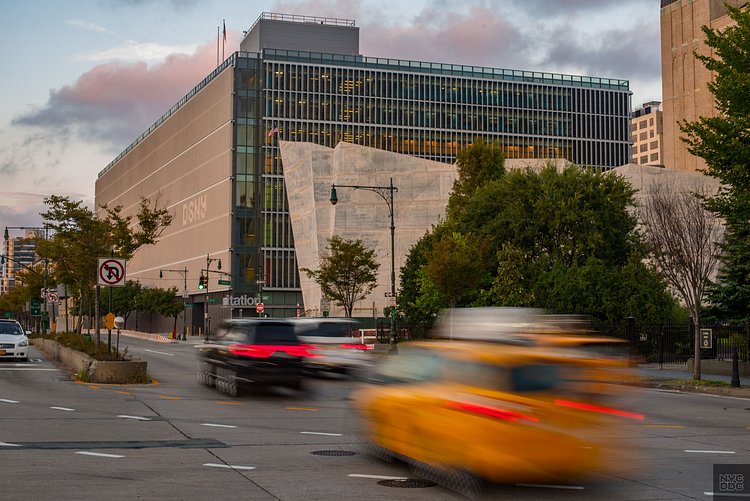 The Spring Street Salt Shed, a 70-foot tall facility that sits next to the Manhattan Districts 1, 2, 5 Garage, stores 5,000 tons of rock salt that is distributed throughout the city’s roads during inclement winter weather. A light color roof paver was chosen for the building to help reduce the heat island effect. The shed’s solid, crystalline surface complements the scrim-like façade of the garage.