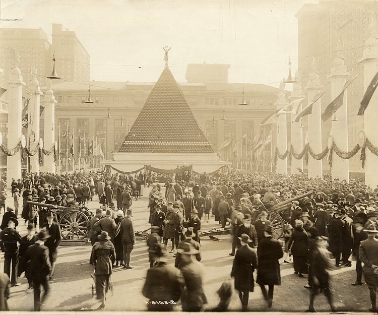 Pyramid of German helmets near Grand Central Terminal : black-and-white photoprint, ca. 1918.