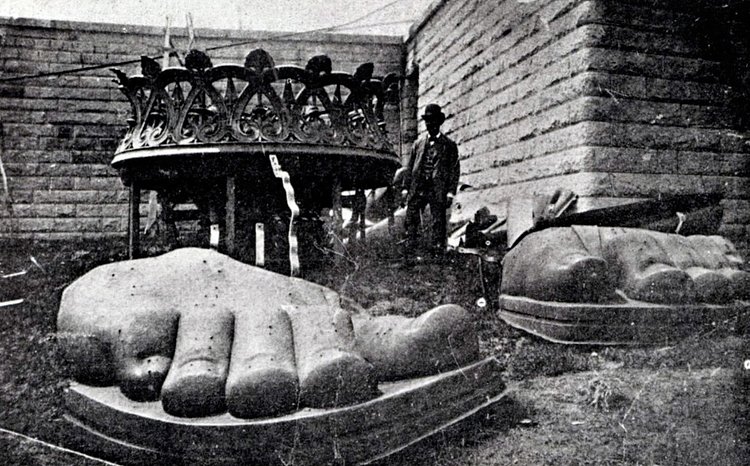 The feet of the Statue of Liberty arrive on Liberty Island in 1885.