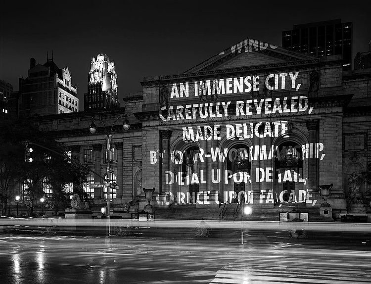 The New York Public Library lit up by Holzer’s projections in 2005. The words are an excerpt from the poem “Love Lies Sleeping” by Elizabeth Bishop.