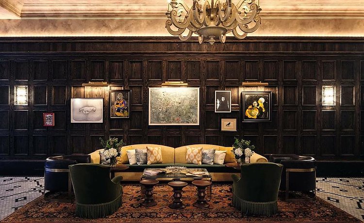 "The ambience is akin to that of a drawing room of the well-travelled" -- Interior designer @MartinBrudnizki on his reception area for @TheBeekmanNY, which relies on dark woods and textural patterned rugs to create a sense of warmth.