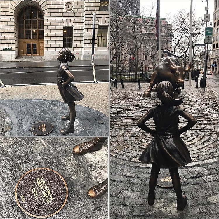 Fearless girl: "Know the power of women in leadership." 💪👗
.
.Came across this epic new statue today as I was balancing on the rainy curb (like I do every morning I walk to work.) She is in a supergirl pose with the above statement on the plaque at her feet. It's her air of grit and bravery as she faces the bull that speaks to me. And the dress. And the ponytail. And hands on hips. SHE IS SO STRONG. .
.
#fearlessgirl #shemakesadifference #womenshistorymonth #ilovenyc #chargingbull #knowthepowerofwomeninleadership