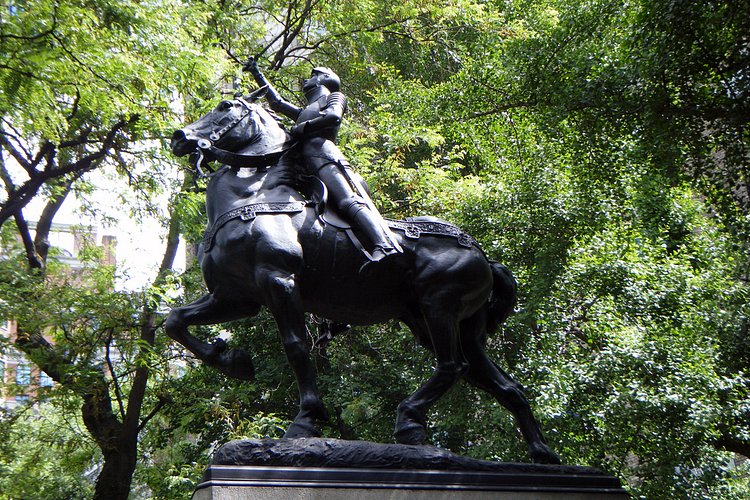 Elle parle à Dieu et aux anges | Joan of Arc as the Maid of Orleans in full armor mounted on a heavy charger, standing in her stirrups with uplifted sword. The base is decorated with arches in the Gothic style.

Joan of Arc Island - Riverside Park - 93rd Street &amp; Riverside Drive in Manhattan, New York City - <a href="http://maps.google.com/maps?f=q&amp;source=s_q&amp;hl=en&amp;geocode=&amp;q=93rd+Street+&amp;+Riverside+Drive+Manhattan,+New+York+City+&amp;sll=46.085154,0.908565&amp;sspn=7.329362,19.753418&amp;ie=UTF8&amp;hq=&amp;hnear=Riverside+Dr+&amp;+W+93rd+St,+New+York,+10025&amp;z=16" rel="nofollow">Google Map</a> - <a href="http://www.flickr.com/photos/sheenachi/tags/joanofarcisland/">additional views</a>