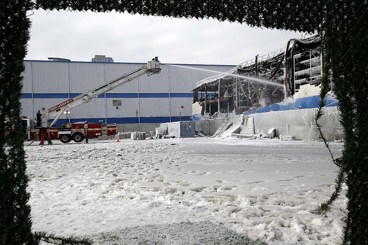 Firefighters continued pouring water on the remains of a 7-alarm fire in a warehouse on the Williamsburg waterfront
