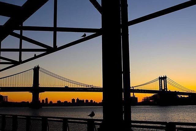 Sunrise under the Manhattan Bridge. New York, New York. Photo via @juliansilvermanphoto #viewingnyc #newyorkcity #newyork #nyc