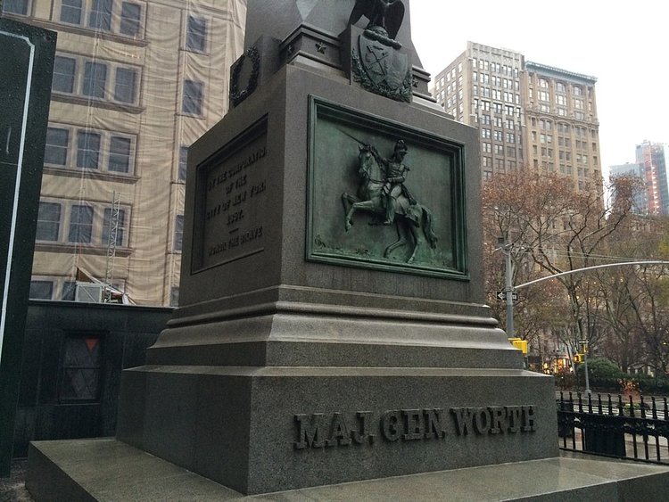 Base of the obelisk, with a bronze relief of the General