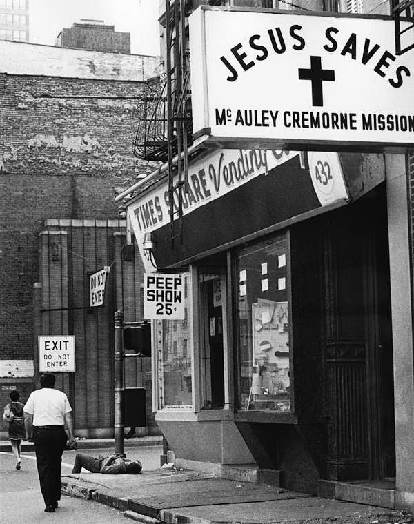 A homeless man sleeps on the sidewalk in front of the McAuley Cremorne Mission in 1985.