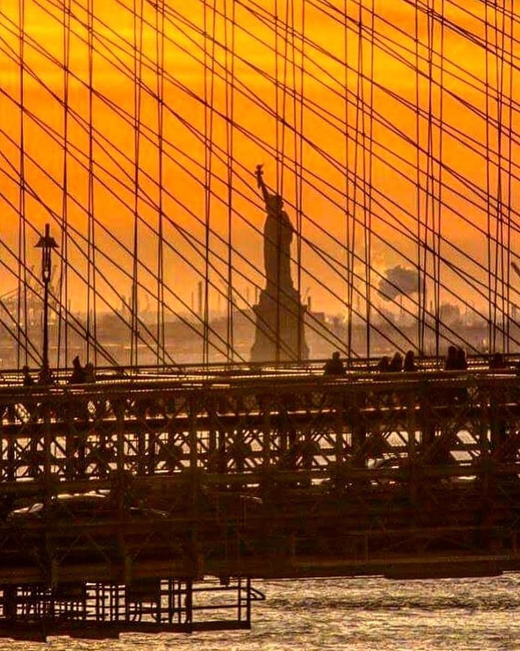 Statue of Liberty through the Brooklyn Bridge, New York