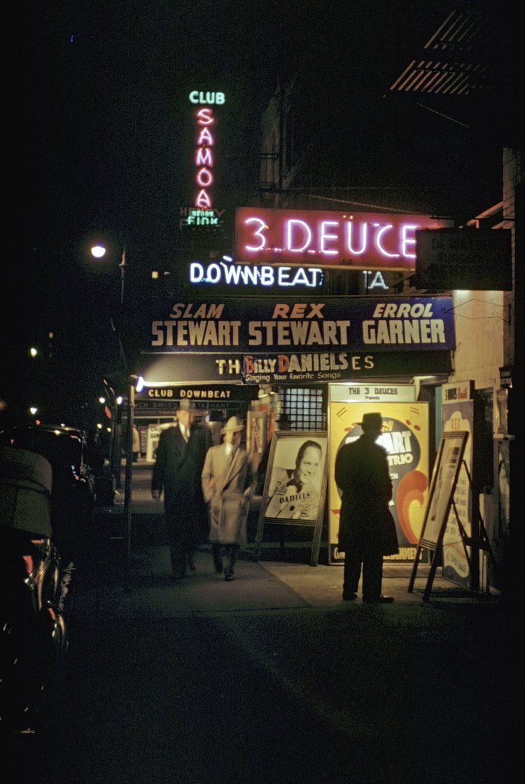 1946 Tourists wander past Club Samoa, Club Downbeat and 3 Deuce in Times Square.