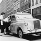 Two women getting into the first British-built Austin taxi licensed in New York, 1960.