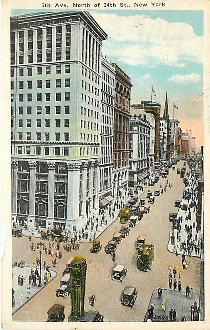 From around 1926 we switch the view around to look north from 34th Street. The building in the foreground is the mutilated Knickerbocker Trust Company. The ornate original three story building at 358 Fifth Avenue, designed by McKim, Mead & White was altered in 1921 with a 10 story addition (seen here) and completely renovated to its current mundane state in 1958. The large structure in the middle of the street at the bottom of the postcard is one of the first traffic signal control towers in New York City.