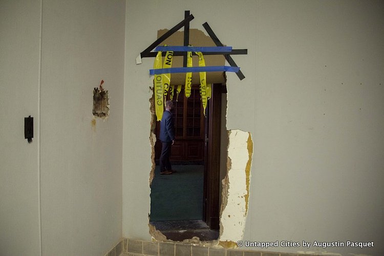 To get from the public banking hall to the offices, a literal hole has been cut in the wall. Just next to this was the temporary office for a past film shoot