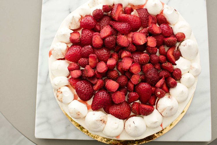 Vanilla cake with layers of Chiboust pastry cream, macerated strawberries, and crushed and whole strawberry-scented meringue.