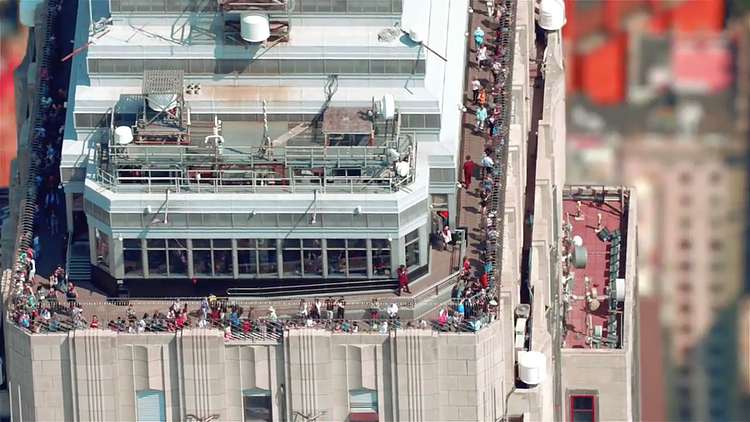 The camera captures a rare view of the Empire State Building's 86th floor observation deck from above. As a testament to its popularity, more money is generated from the observatory than the renting of office space in the building.