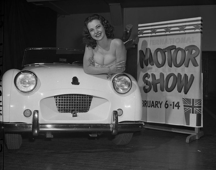 This little Triumph TR2 sports car has quite the companion at the International Motor Show.