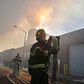 Firefighters continued pouring water on the remains of a 7-alarm fire in a warehouse on the Williamsburg waterfront