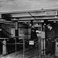 A man gets change in nickels from a change booth operator so he can pass through the new nickel-operated turnstiles which have replaced the ticket and ticket-chopper (a man who manually cut tickets at the gate) system in the New York City subway, early 1920s. The move allowed subway companies to reduce operating costs by drastically reducing personnel.