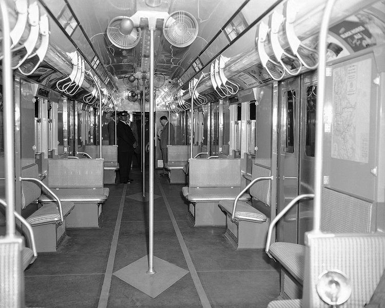 Interior view of the subway car of the future as it was displayed at the Chambers Street Station of the Independent Division in New York on July 9, 1947. The new car has 56 seats, 14 adjustable, exhaust ventilators, eight 10-inch fans, is painted blue and grey and has an off-white ceiling.