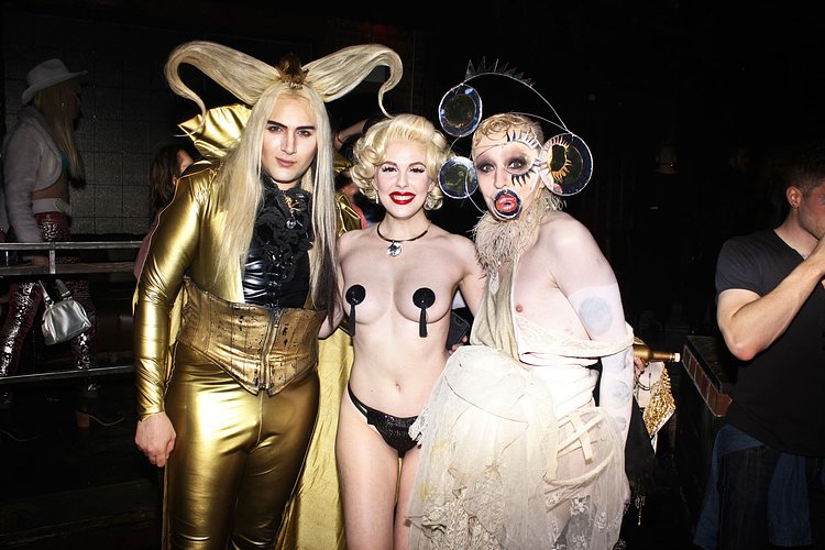 The evening's hosts, Kayvon Zand, who Pandy calls "an original downtown club kid from the RuPaul days" and musician Kenny Kenny, sandwich Zand's fiancée, Evans.