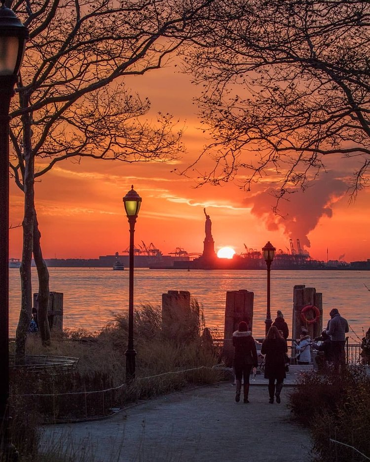 Sunset over Liberty Island from Battery Park, Manhattan