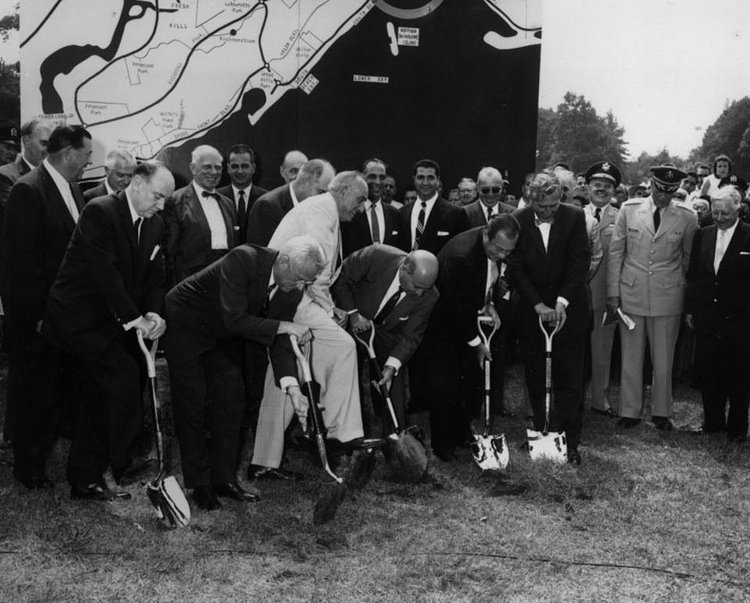 Groundbreaking ceremony for the construction of the Verrazano-Narrows Bridge was held at Fort Wadsworth. Pictured left to right; Robert F. McAlevy Jr., S. Sloan Colt, Robert Moses, William J Tracy (behind Moses), Albert V Maniscalco, Robert F Wagner, and Robert B Meyner. Photo circa August 1959. 