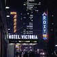 1946 New York street showing the Hotel Abbey, Hotel Victoria and the Roxy in Times Square. In the background is the Rockefeller Center.