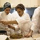 Refugee chefs with Eat Offbeat prepare a meal