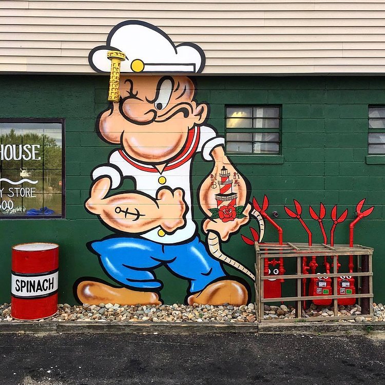 POPEYE #⚓️ hauling in the #lobsters #🦀🦀 #eyeballin #👀 #spinachcan #🌿#newbedford #🐳#massachusetts #streetart #tombobnyc #mural @lighthousesupply_nbma #popeye #💪🏼 #thesailorman #nbma #🐋 #popeyethesailorman #tombob #stencilart #oneyearago