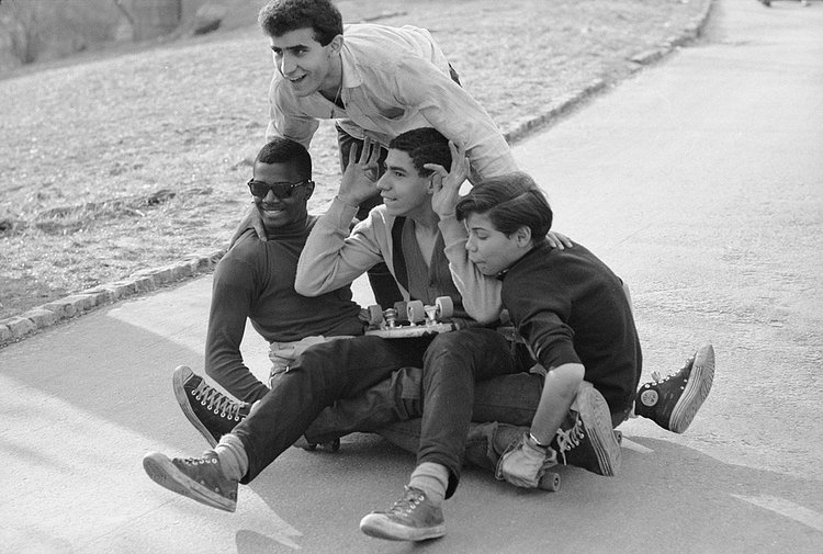Skaters pose for a photo in Central Park while the boy on the right stifles his vomit.