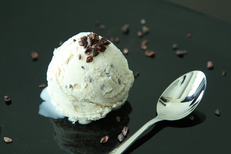 Cocoa Nib Ice Cream | A unique tasting ice cream ---- taste like vanilla ice cream but yet has a hint of chocolate taste as well. Didnt have to make a custard for this ice cream hence being eggless it really brought out the clean chocolate flavour after the cream was infused with the Valhorna cocoa nibs. Also added 2 more tbsp of cocoa nibs to turn this into a  double cocoa nib ice cream otherwise known as chocolate-chip ice-cream. But here the crunchiness of the nibs mixed with the creaminess of the cream is just divine.
(Recipe from Alice Merdrich's Bitterswett)