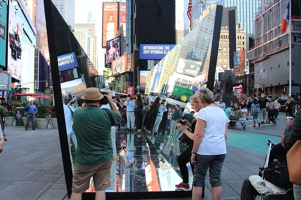 Pedestrians walk through the "kaleidoscope."