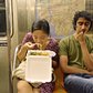 Woman Eating Takeout on Subway While Man Gives Side Eye | You can use this photo for non-commercial purposes if you give credit, under this <a href="https://creativecommons.org/licenses/by-nc/3.0/us/" rel="nofollow">Creative Commons license</a>. For-profit media organizations also may use this, but as editorial content only (as illustrations for stories, for example, but not as advertising). Credit must read: Richard Yeh / WNYC

We'd love to know if you're using this photo - send us an email (jkeefe@wnyc.org)!