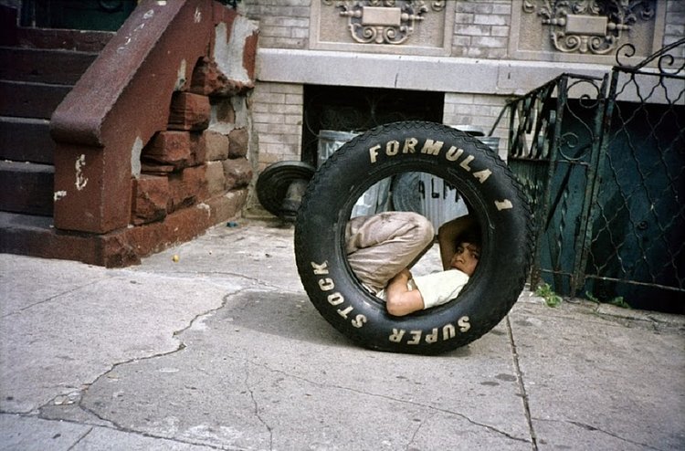 Boy in a Tire, Bushwick, Brooklyn, NY, 1984.