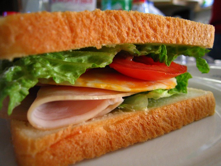 sandwich! | i was starving today... like i think my stomach was eating itself in anger for mee not feeding it. sooo i made a sandwich! :D

delicious asian baked white bread + romaine + fresh tomatoes + colby cheese + roasted turkey + little bit of mayo = ^____^

i'm still hungry though...