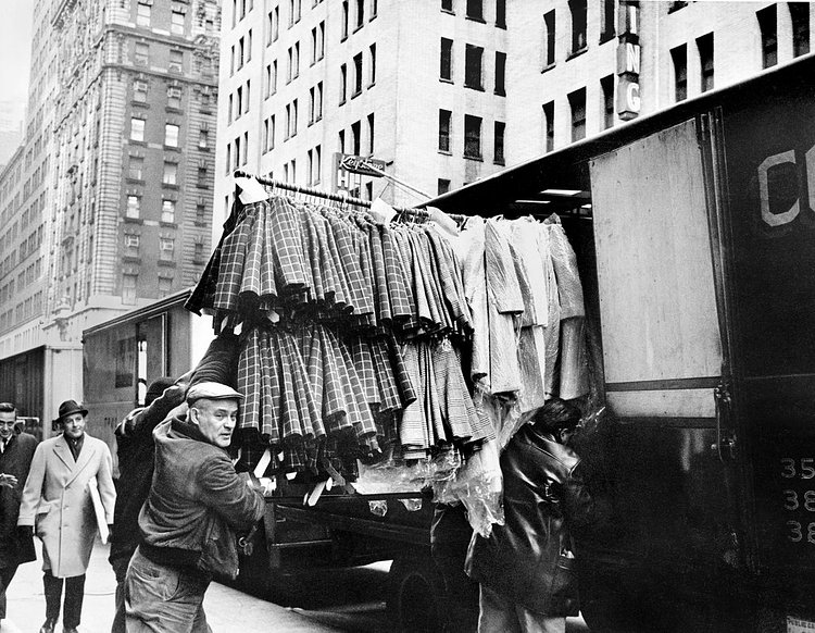Jan. 31, 1967: Unloading garments in Manhattan’s “congested, busy streets (where one worker barely dodged a group of converging handtrucks last week and said, bitterly, ‘Kind of like a snake pit’).” The Times reported on the challenges confronting the fabric industry, whose smaller producers “supply the nuts and bolts of the garment industry — the buttons, the linings, zippers, trimmings, machines, the trucks and even the sandwiches — and what is more important?”