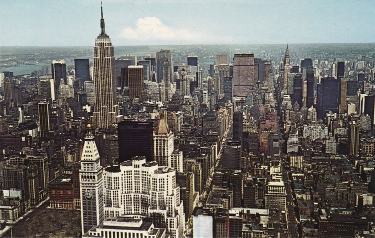 Turning the view north, the white skyscrapers in the foreground are the Metropolitan Life Building and New York Life Insurance Buildings.