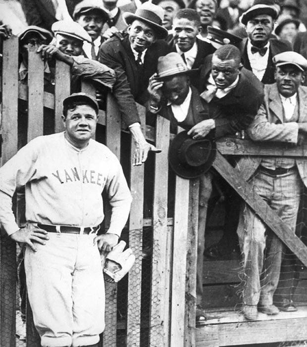 Babe Ruth posing with fans 1925.